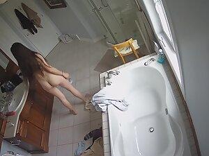 Spying on fit girl getting naked for a shower