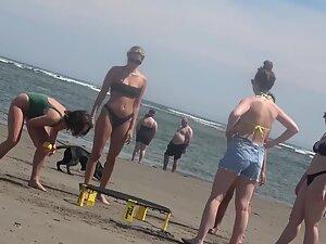Clumsy but sexy group of girls playing a game on the beach