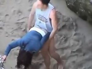 Savage beach fuck caught by a voyeur