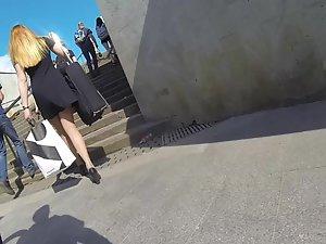 Upskirt while she carries a suitcase Picture 3