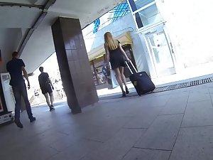 Upskirt while she carries a suitcase Picture 6