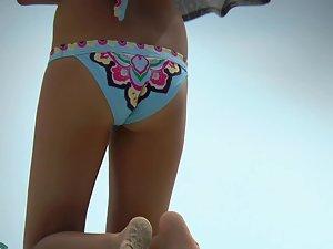 Peeping on gorgeous teen girl on beach Picture 6