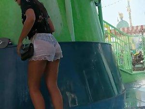 Shy girl tries to hide her ass and thong in wet shorts Picture 3