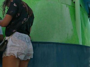 Shy girl tries to hide her ass and thong in wet shorts Picture 8