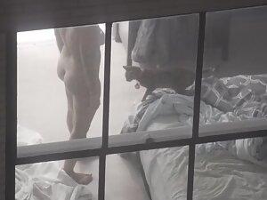 Peeping on naked neighbor interacting with her cat