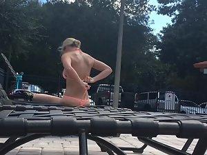 Peeping on astonishing blonde suntanning by the pool Picture 2
