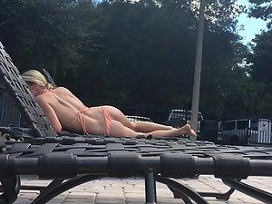 Peeping on astonishing blonde suntanning by the pool Picture 3