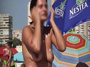 Spying a topless girl reading on a beach Picture 6