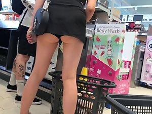 Bending over at cashier line exposes her upskirt Picture 2