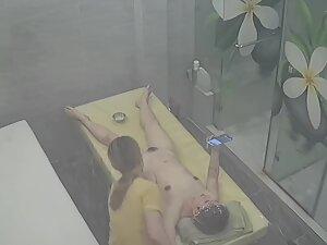 Naked woman is on her phone during entire massage Picture 4