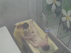 Naked woman is on her phone during entire massage Picture 5