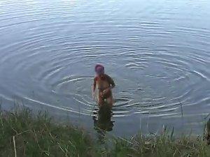 Naked girl at a lake side beach Picture 8