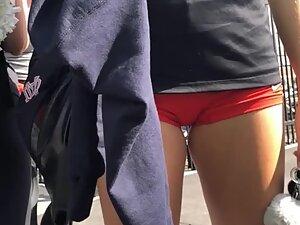 Hot pussy bulge in red shorts of an athletic girl