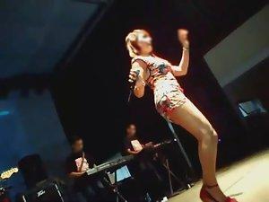 Upskirt of a girl singing on the stage Picture 3