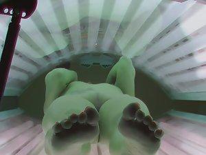 Tattooed girl spreads legs while tanning Picture 1