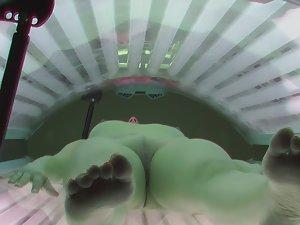 Tattooed girl spreads legs while tanning Picture 3