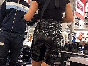 Shiny black shorts make her ass hard to miss Picture 2