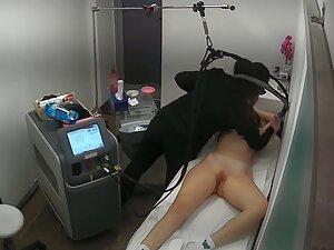 Busty blonde spied while she gets hair removal treatment Picture 2