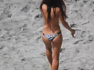 Voyeur zooms on happy topless girl at beach Picture 1