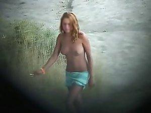 Young topless girl spied on a beach Picture 1