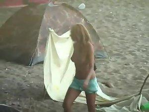 Young topless girl spied on a beach Picture 3