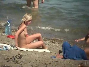 Skinny naked girl at the beach gets spied Picture 7