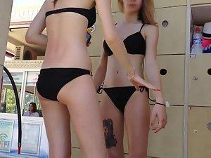 Tattooed girl with friends by the pool Picture 4