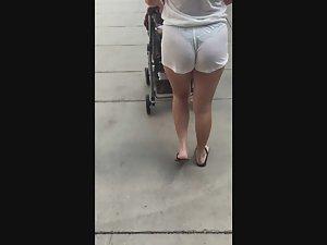 Milf shows her hot ass and thong in white shorts Picture 7