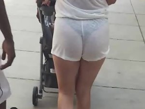 Milf shows her hot ass and thong in white shorts