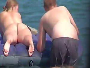 Hot girl on an air mattress at a beach Picture 1