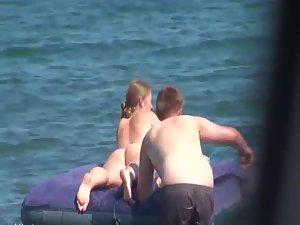 Hot girl on an air mattress at a beach Picture 6