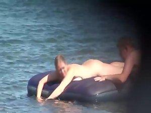 Hot girl on an air mattress at a beach Picture 8