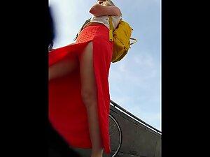 Red dress with a big cut shows a lot of upskirt Picture 4