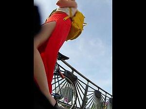 Red dress with a big cut shows a lot of upskirt Picture 6