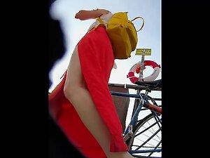 Red dress with a big cut shows a lot of upskirt Picture 7