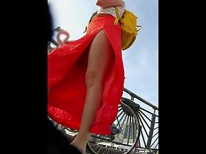 Red dress with a big cut shows a lot of upskirt Picture 8