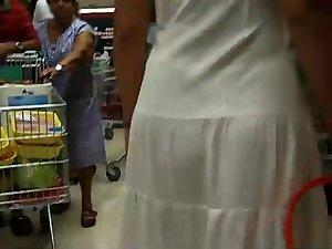 Thong peeks through her white dress Picture 2