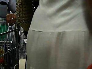 Thong peeks through her white dress Picture 3