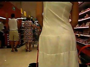Thong peeks through her white dress Picture 6