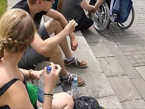 She sits on the curb and I spy her tits Picture 5