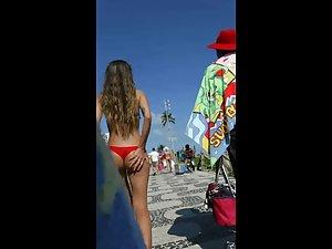 Tiny round ass in red bikini can't be missed Picture 1