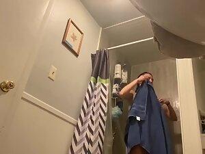 Hidden cam caught surprisingly big tits in bathroom Picture 2