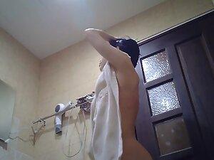 Spying on petite asian girl's wet tits after shower Picture 5