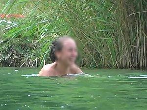 Bald boyfriend splashing water on topless girlfriend Picture 3