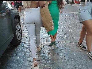Voyeur notices a visible thong line under blonde's white pants Picture 1