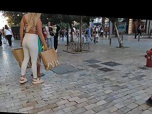 Voyeur notices a visible thong line under blonde's white pants Picture 5