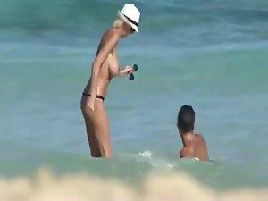 Skinny topless girl enters the water Picture 7
