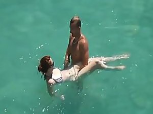 He teaches her how to swim