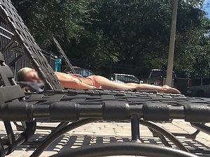 Amazing blonde sunbathes by the swimming pool Picture 5