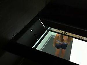 Peeping on her through a hole